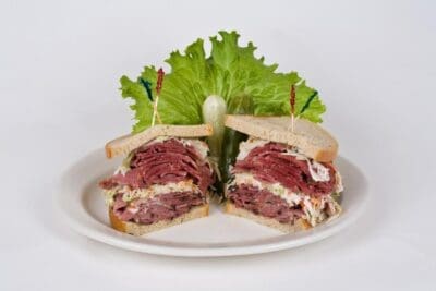 Specialty Sandwiches – No. 6 Our famous #6 - corned beef, pastrami, coleslaw and your choice of russian or mustard